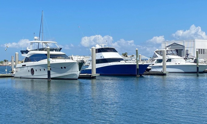 Tampa Boat Rental | 48’ Hattaras Sport Yacht onTreasure Island inter coastal near johns pass village