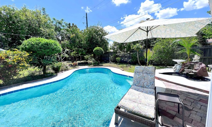 Camellia Gardens House | 4BR/2.5BTH Saltwater Pool home with Outdoor Kitchen and Fruit Trees
