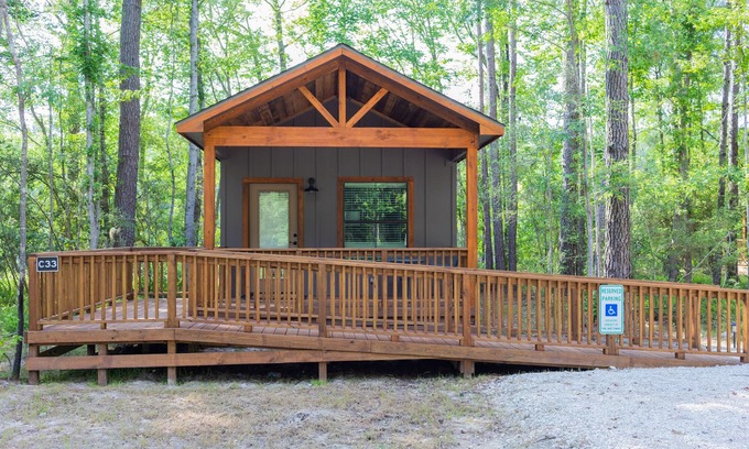 Livingston Cabin | A Cozy ADA Accessible Getaway Right on the Water, Two Creeks Crossing Resort