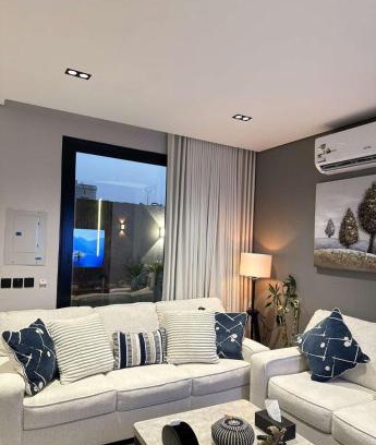 Al Hofuf Apartment | A cozy two-bedroom apartment with a living room and a patio that inspires relaxation