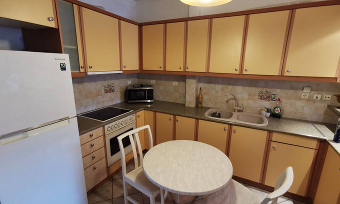 Voula Apartment | A lovely ground floor apartment with a backyard patio