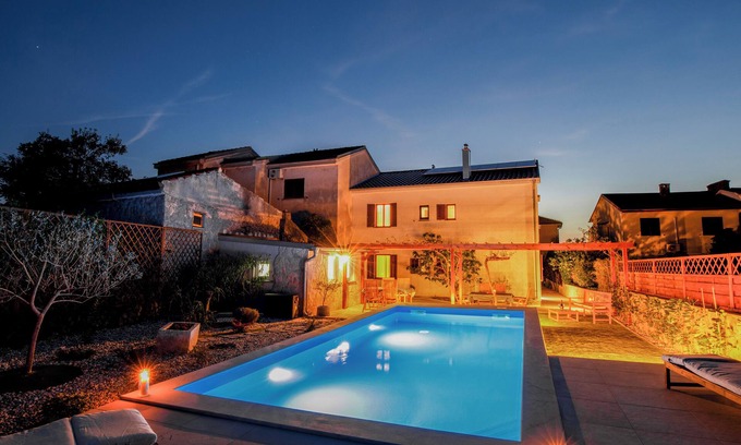 Punat House | A peaceful holiday home with a heated pool, ideal for two families