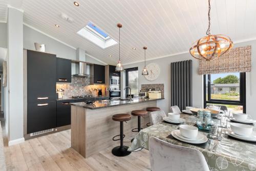 Penally House | Ael-Y-Bryn - Luxury Lodge, Hot Tub, Three En-Suite Bedrooms