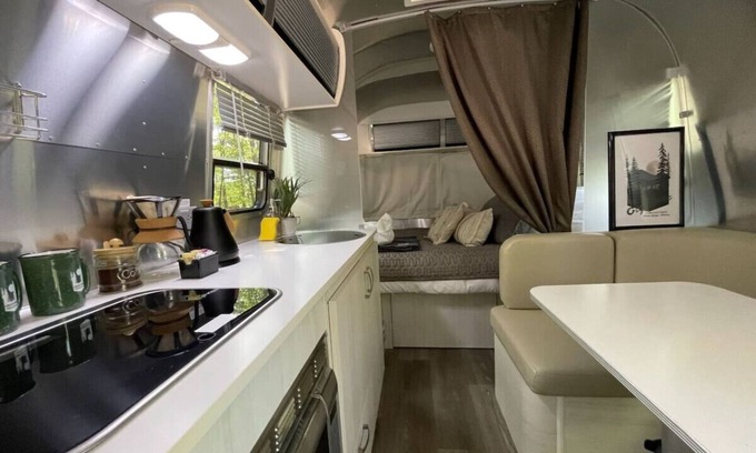 Eureka Springs RV Rental | Airstream Bambi with Hot Tub and outdoor kitchen