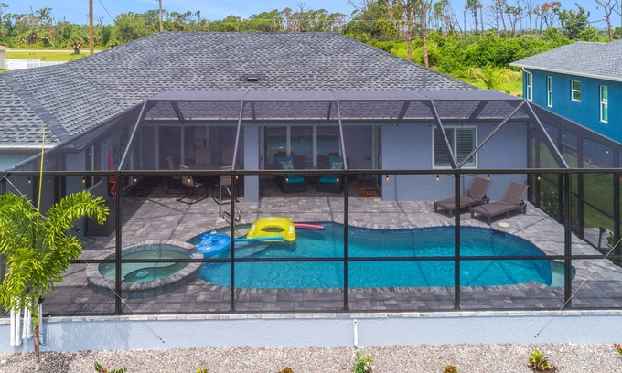 Pine Valley House | ALL the amenities! New home with hot tub, on canal, dock, everything you need!