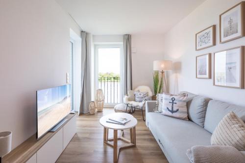 Norderhafen Apartment | Apartment N14 direkt am Nordseedeich mit Blick auf den See