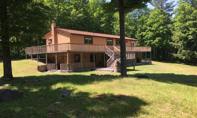 Deerton Cabin | Atv-Snowmobile Trail, sits on the Laughing Whitefish River, sleeps 16 people.