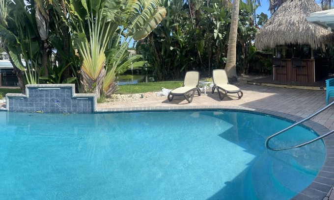 Imperial Point House | Backyard Paradise: 2bd/2bath Waterfront Home, Heated Salt Water Pool, Tiki Bar
