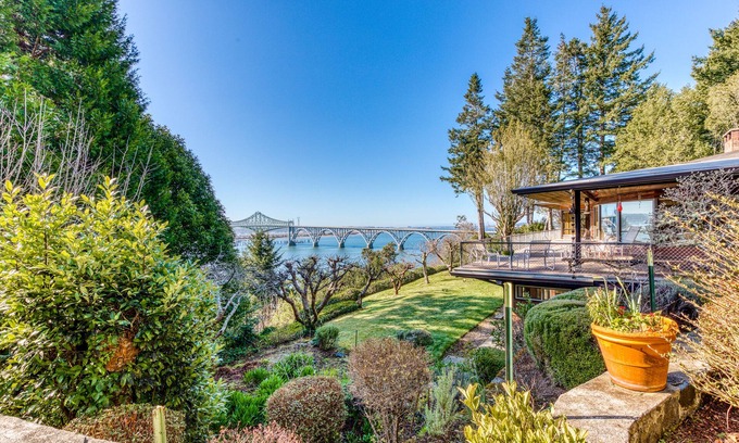 North Bend House | Bayfront home with fitness room, WiFi & fun-filled game room