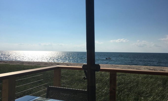 Southold Cottage | Beachfront - endless sunsets, sandy beach, cozy sunroom & open concept kitchen