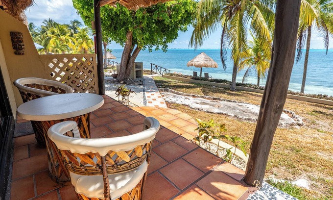 Isla Mujeres Cottage | Beachfront palapa cottage with heated pool , sunsets and tropical gardens