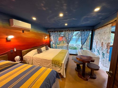 Santa Maria Tonameca Hotel | Beachfront Paradise Boutique Hotel - Alebrijes Jacuzzi Suits