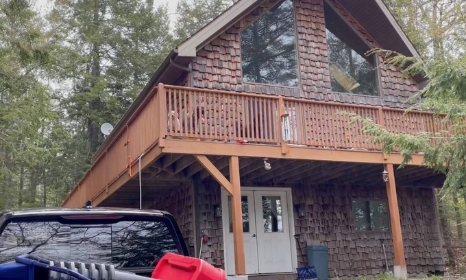 Hancock County Ski Chalet | Beautiful beachfront chalet with southern exposure on Green Lake,Dedham, Maine.