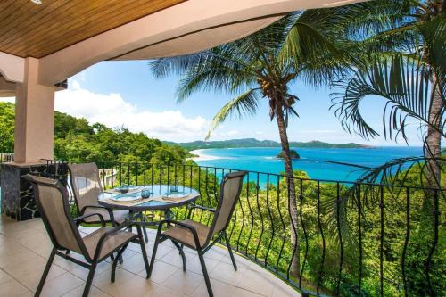 Playa Flamingo House | Beautiful Condo in Peaceful Cliffside Location with a Private Balcony & Stunning Ocean and Mountain Views