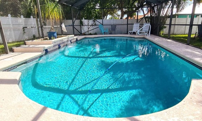 Port Saint Lucie House | Beautiful Home in East Port St Lucie. Heated and Screened Saltwater Pool