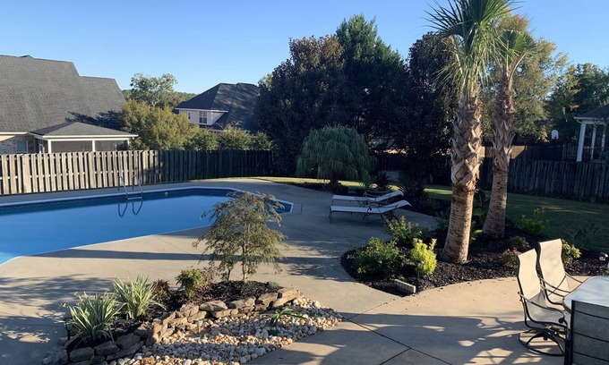 Evans House | Beautiful Masters Rental with pool & tropical landscaping