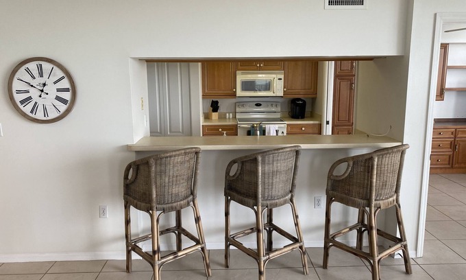 Pelican Bay Condo | Beautiful sunset views of the Gulf from this western facing 9th floor condo.
