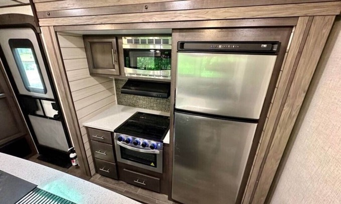 Lucas RV Rental | Black Fork River front fully functioning Camper