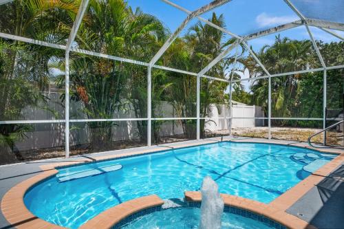 Bradenton House | Bloom Lagoon! Tropical home with heated pool and grill! Pet Friendly!