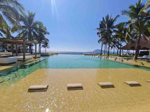 Olas Altas Apartment | Bonito departamento pie de playa en el mejor condominio de manzanillo, Ponto Horizonte. Hermosa vista, hasta para 8 personas. Ambiente familiar.