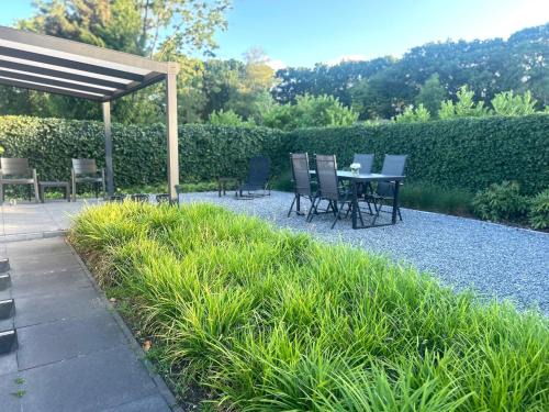 Oisterwijk Ski Chalet | Boscottage met ruime tuin en airco!