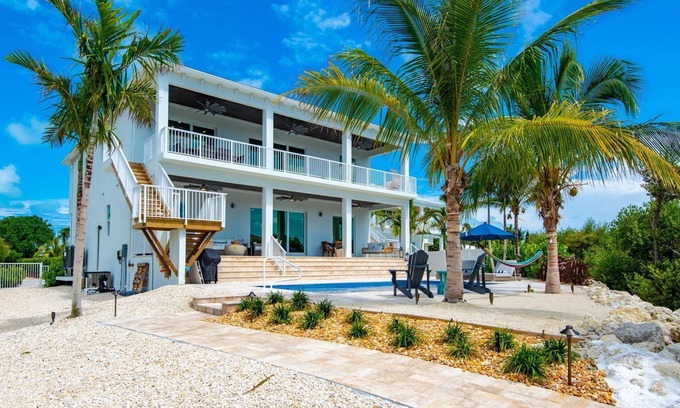Marathon Villa | Brand New Single Family 5/5 -90ft dock, pool, paddle boards, bicycles plus more!