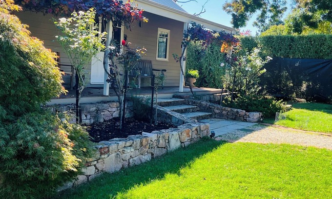 Wandiligong House | *BRIGHT* Modern Home with large outdoor deck and outside fireplace.