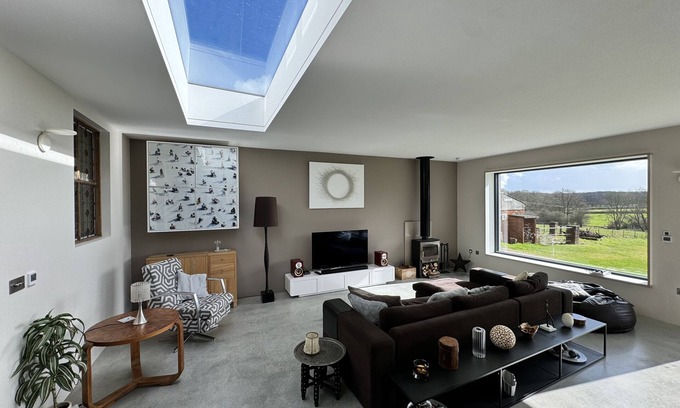 Newdigate House | Bright spacious home with a natural swimming pond in Surrey Hills