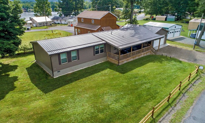Bradford House | Bring your boat, this home offers a dock to tie up to and 10 feet of lakefront.
