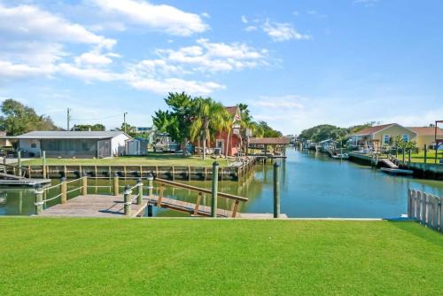 Butler Beach House | Canal Front Home! Walk to Beach, Porch, Fishing
