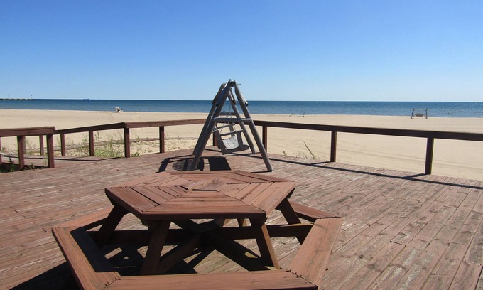 Au Sable Condo | Carpe Diem 365 located on Lake Huron sandy beach!