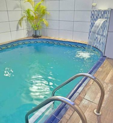 Maracana House | Casa com Piscina Cascata Na Praia Grande