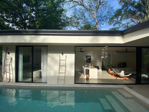 Carmen Villa | Casa Remy - Walk to the Beach and stay in a private compound! Pool, Kitchen, AC, Wi-Fi