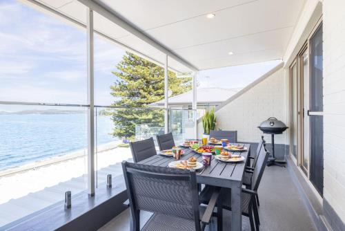 Soldiers Point Apartment | Casuarina's 6, 33 Soldiers Point Rd - stunning waterfront unit