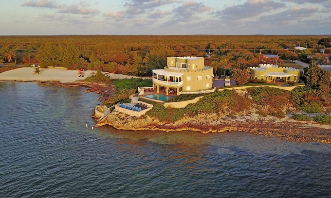 Gun Bay House | Cayman Castle: Luxury Gated Estate w/Elevated Views, Infinity Pool + Large Private Beach
