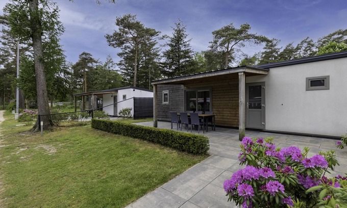 Vessem Ski Chalet | chalet with covered terrace on campsite with pool