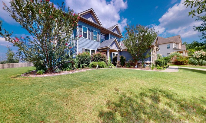 Riverwood Plantation House | Champions Retreat | Dog-friendly home with fireplace, grill, and sunny patio