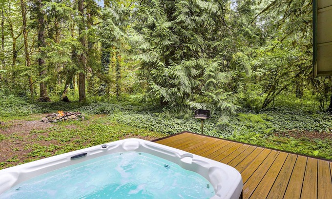 Skykomish House | Charming cabin with hot tub, firepit, wood stove, & W/D - near Stevens Pass