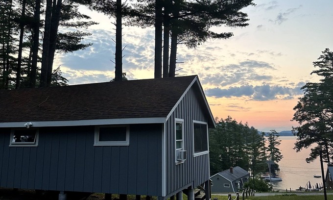 Alton Bay Cottage | Charming cottage with beach access, a grill, dock, & nearby golf