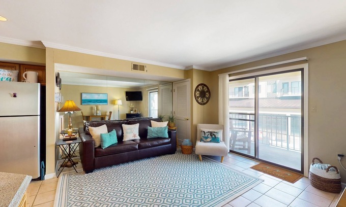 Caine Woods Condo | Coastal and Beachy Condo with Pool and Hot tub access - steps from beach