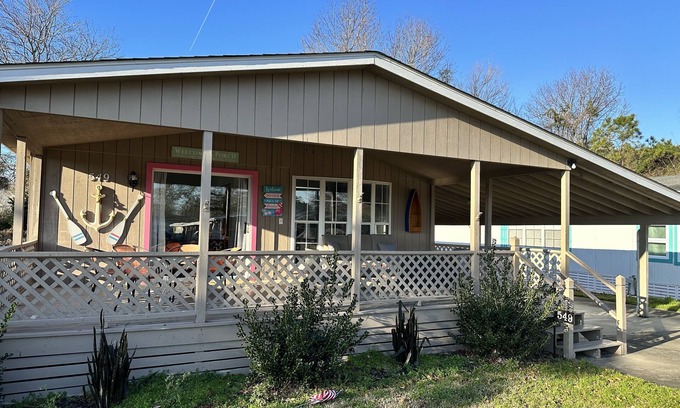 Garden City Cottage | Coastal cottage minutes from the beach. Large front porch for morning sun!