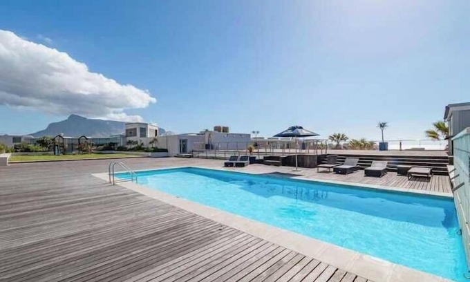 Lagoon Beach Apartment | Coastal Escape with Stunning Mountain Backdrop