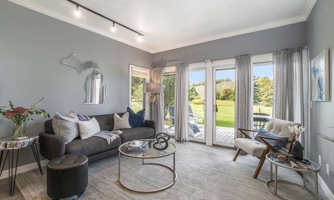 Cedar Condo | Come cozy up next to the fireplace at our contemporary condo centrally located