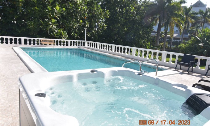 Mammee Bay Villa | Comfy bedrooms minutes away from beach, free WIFI, spa hut, BBQ,24-hour security