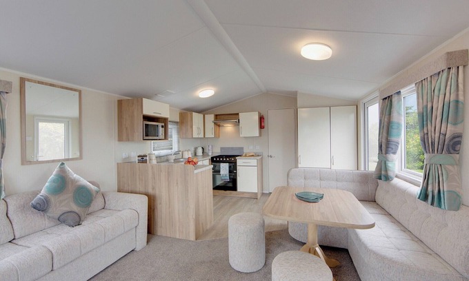 Kilwinning House | Contemporary caravan with one double with TV, and two twin.