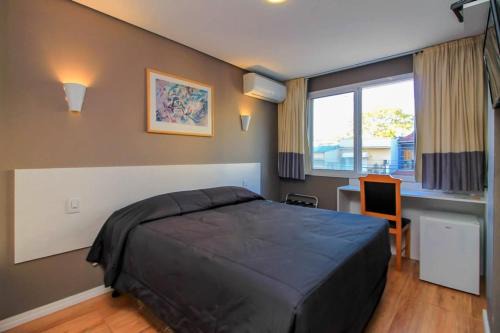 Menino Deus Hotel | CORAL EXPRESS Prox á PUCRS, 5klm de distancia