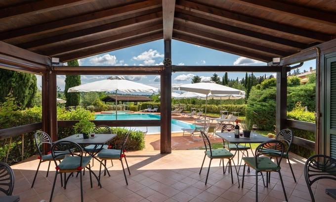 Sughera Apartment | Cosy apartment with A/C, pool, WIFI, TV, terrace, panoramic view and parking, close to San Gimig.