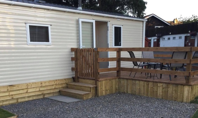 Boat of Garten House | Cosy chalet - Poppy Lodge in Boat of Garten, Dog Friendly, free wifi!