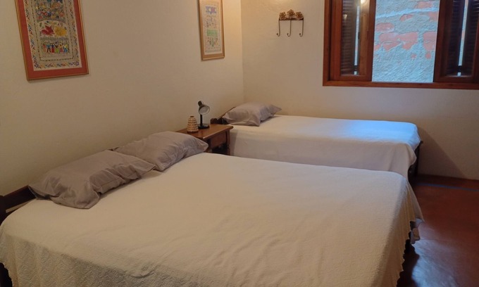 Praia da Fortaleza Apartment | Couples' suite with your feet in the sand at Praia da Fortaleza