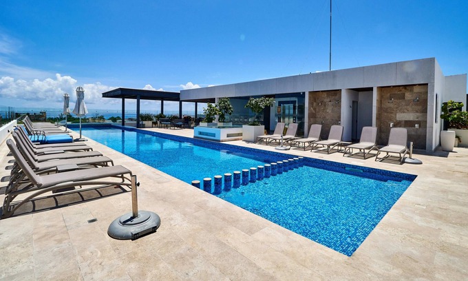 Tohoku Apartment | Cozy Apartment in Playa del Carmen | Game Room, Gym & Rooftop Pool | Great Amenities